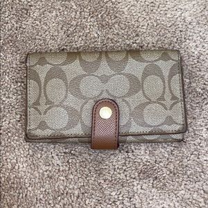 Coach tan and brown wallet.